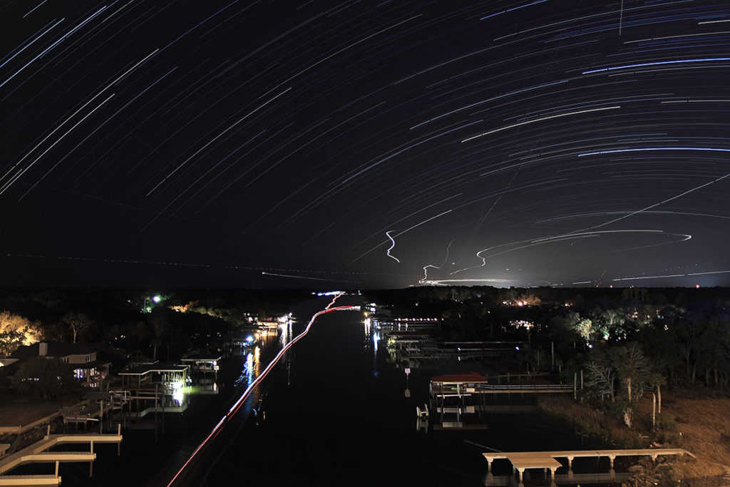star trails over an airport
